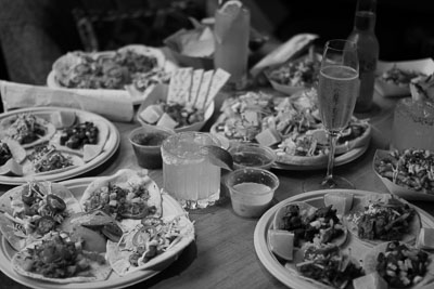 Tablescape filled with plates of Mexican food